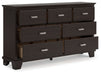 Covetown - Dresser - Dark Brown – Dressers by Signature Design by Ashley® at Furniture Wholesale Plus , Nashville furniture store