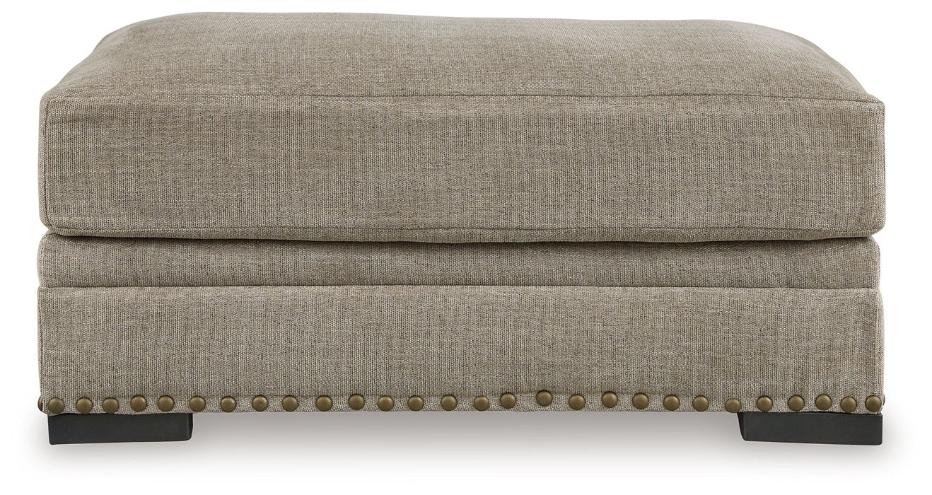 Galemore - Ottoman - Quarry – Upholstered Ottomans by Benchcraft® at Furniture Wholesale Plus , Nashville furniture store
