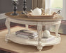 Realyn - Oval Cocktail Table - White / Brown – Cocktail Tables by Signature Design by Ashley® at Furniture Wholesale Plus , Nashville furniture store