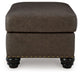 Roxmere - Ottoman - Umber – Upholstered Ottomans by Benchcraft® at Furniture Wholesale Plus , Nashville furniture store