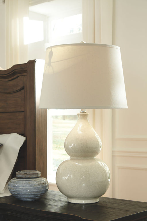 Saffi - Cream - Ceramic Table Lamp - Premium Table Lamps from Signature Design by Ashley® - Just $138! Shop now at Furniture Wholesale Plus  We are the best furniture store in Nashville, Hendersonville, Goodlettsville, Madison, Antioch, Mount Juliet, Lebanon, Gallatin, Springfield, Murfreesboro, Franklin, Brentwood