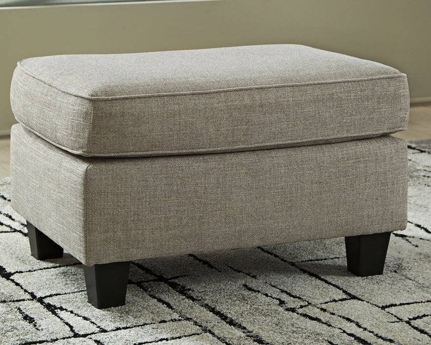 Kestrel - Ottoman - Driftwood – Upholstered Ottomans by Ashley® at Furniture Wholesale Plus , Nashville furniture store