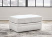 Maitelynn - Ottoman - Chalk – Upholstered Ottomans by Ashley® at Furniture Wholesale Plus , Nashville furniture store