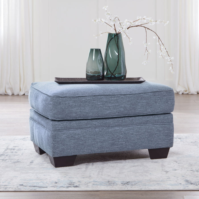 Carissa Manor - Ottoman - Denim – Upholstered Ottomans by Benchcraft® at Furniture Wholesale Plus , Nashville furniture store
