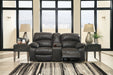 Dunwell Power Reclining Loveseat with Console - Premium Loveseat from Ashley Furniture - Just $1226.13! Shop now at Furniture Wholesale Plus  We are the best furniture store in Nashville, Hendersonville, Goodlettsville, Madison, Antioch, Mount Juliet, Lebanon, Gallatin, Springfield, Murfreesboro, Franklin, Brentwood