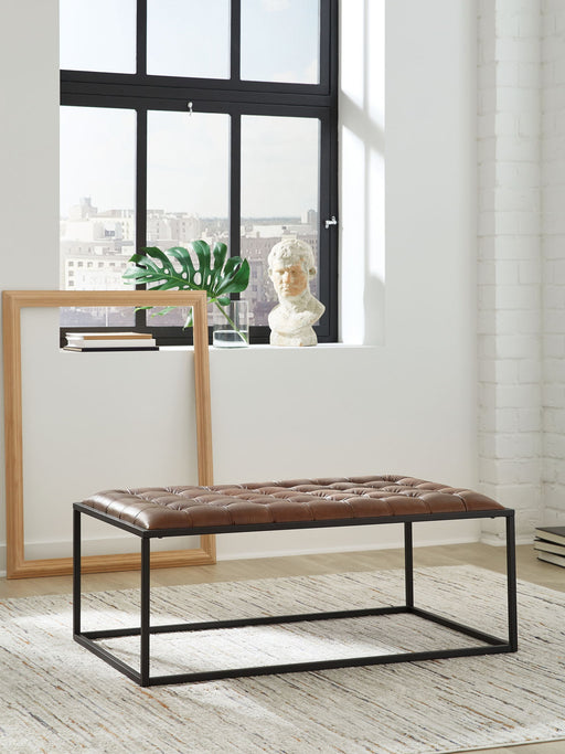 Junsor - Cocktail Ottoman - Brown / Black – Coffee Table Ottomans by Signature Design by Ashley® at Furniture Wholesale Plus , Nashville furniture store