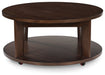 Korestone 2 - Round Cocktail Table - Dark Brown – Coffee Tables by Signature Design by Ashley® at Furniture Wholesale Plus , Nashville furniture store