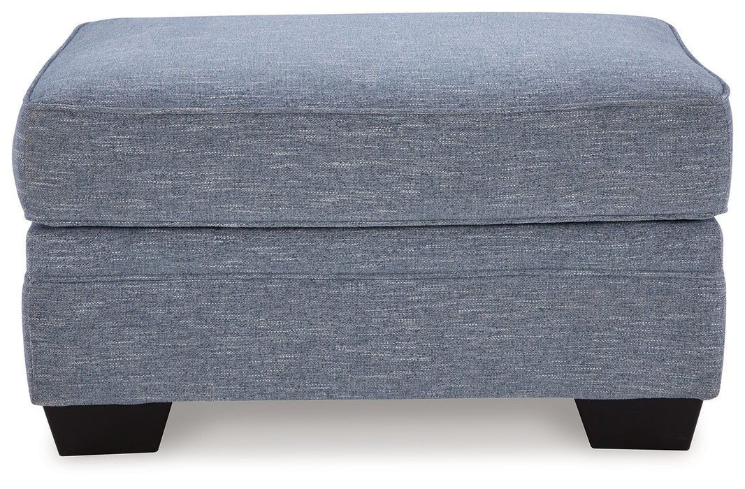 Carissa Manor - Ottoman - Denim – Upholstered Ottomans by Benchcraft® at Furniture Wholesale Plus , Nashville furniture store