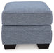 Carissa Manor - Ottoman - Denim – Upholstered Ottomans by Benchcraft® at Furniture Wholesale Plus , Nashville furniture store