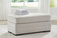 Eastonbridge - Ottoman - Shadow – Upholstered Ottomans by Benchcraft® at Furniture Wholesale Plus , Nashville furniture store