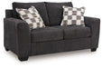 Loreo - Loveseat - Ebony – Stationary Loveseats by Benchcraft® at Furniture Wholesale Plus , Nashville furniture store