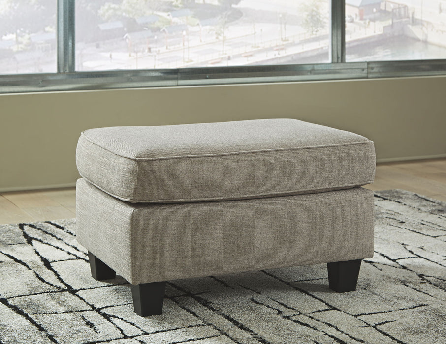 Kestrel - Ottoman - Driftwood – Upholstered Ottomans by Ashley® at Furniture Wholesale Plus , Nashville furniture store