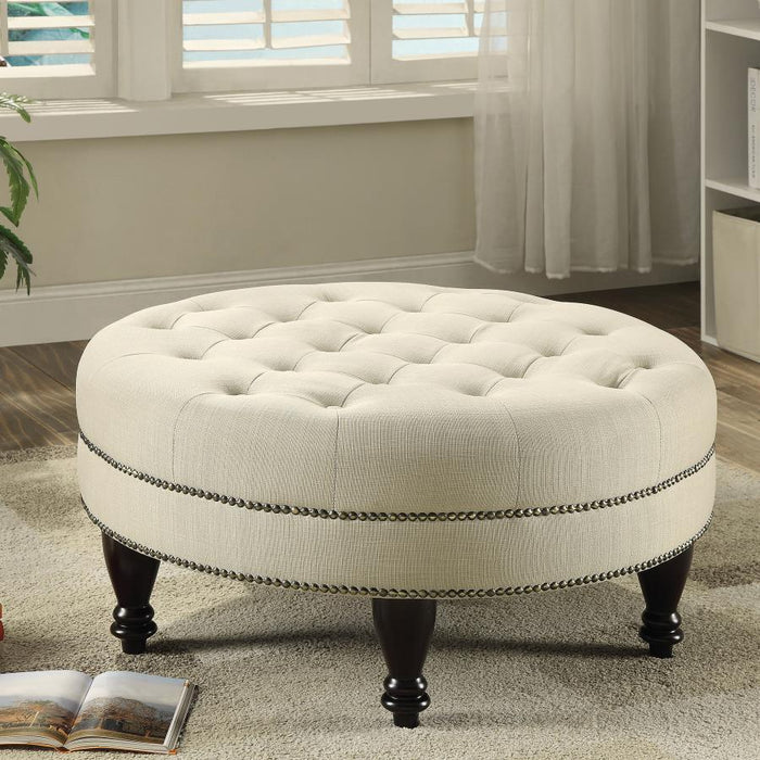 Elchin - Round Upholstered Tufted Ottoman - Oatmeal – Upholstered Ottomans by CoasterEssence at Furniture Wholesale Plus , Nashville furniture store