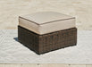 Coastline Bay - Brown - Ottoman With Cushion - Premium Ottomans from Signature Design by Ashley® - Just $298! Shop now at Furniture Wholesale Plus  We are the best furniture store in Nashville, Hendersonville, Goodlettsville, Madison, Antioch, Mount Juliet, Lebanon, Gallatin, Springfield, Murfreesboro, Franklin, Brentwood