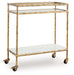 Plattfield - Antique Gold Finish - Bar Cart - Premium Bar Carts from Signature Design by Ashley® - Just $258! Shop now at Furniture Wholesale Plus  We are the best furniture store in Nashville, Hendersonville, Goodlettsville, Madison, Antioch, Mount Juliet, Lebanon, Gallatin, Springfield, Murfreesboro, Franklin, Brentwood