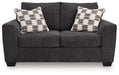Loreo - Loveseat - Ebony – Stationary Loveseats by Benchcraft® at Furniture Wholesale Plus , Nashville furniture store