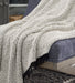 Leonita Throw - Premium Throw from Ashley Furniture - Just $37.40! Shop now at Furniture Wholesale Plus  We are the best furniture store in Nashville, Hendersonville, Goodlettsville, Madison, Antioch, Mount Juliet, Lebanon, Gallatin, Springfield, Murfreesboro, Franklin, Brentwood