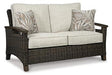 Paradise Trail Loveseat with Cushion - Premium Outdoor Seating from Ashley Furniture - Just $1007.22! Shop now at Furniture Wholesale Plus  We are the best furniture store in Nashville, Hendersonville, Goodlettsville, Madison, Antioch, Mount Juliet, Lebanon, Gallatin, Springfield, Murfreesboro, Franklin, Brentwood