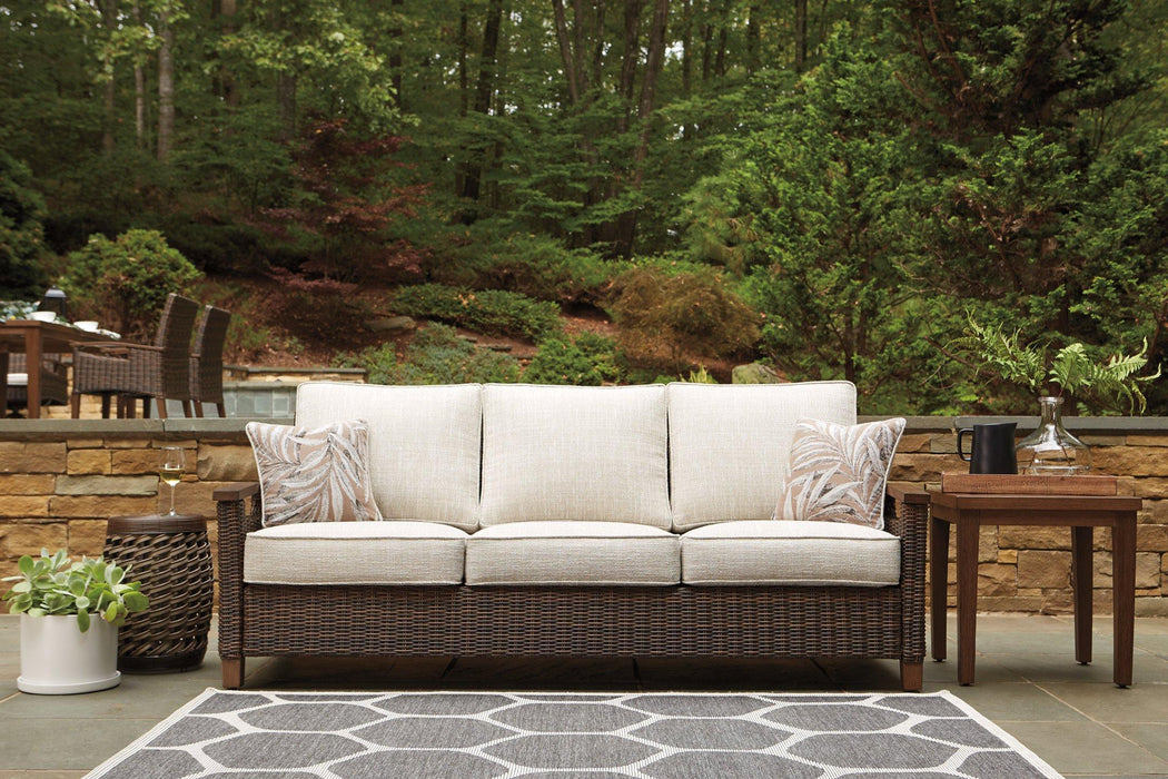 Paradise Trail Sofa with Cushion - Premium Outdoor Seating from Ashley Furniture - Just $1318.41! Shop now at Furniture Wholesale Plus  We are the best furniture store in Nashville, Hendersonville, Goodlettsville, Madison, Antioch, Mount Juliet, Lebanon, Gallatin, Springfield, Murfreesboro, Franklin, Brentwood