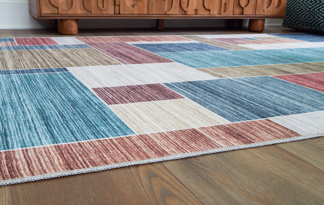 Numore Rug - Premium Rug Large from Ashley Furniture - Just $90.36! Shop now at Furniture Wholesale Plus  We are the best furniture store in Nashville, Hendersonville, Goodlettsville, Madison, Antioch, Mount Juliet, Lebanon, Gallatin, Springfield, Murfreesboro, Franklin, Brentwood