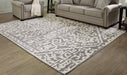 Oddetteley 7'10" x 10'1" Rug - Premium Rug from Ashley Furniture - Just $249.76! Shop now at Furniture Wholesale Plus  We are the best furniture store in Nashville, Hendersonville, Goodlettsville, Madison, Antioch, Mount Juliet, Lebanon, Gallatin, Springfield, Murfreesboro, Franklin, Brentwood