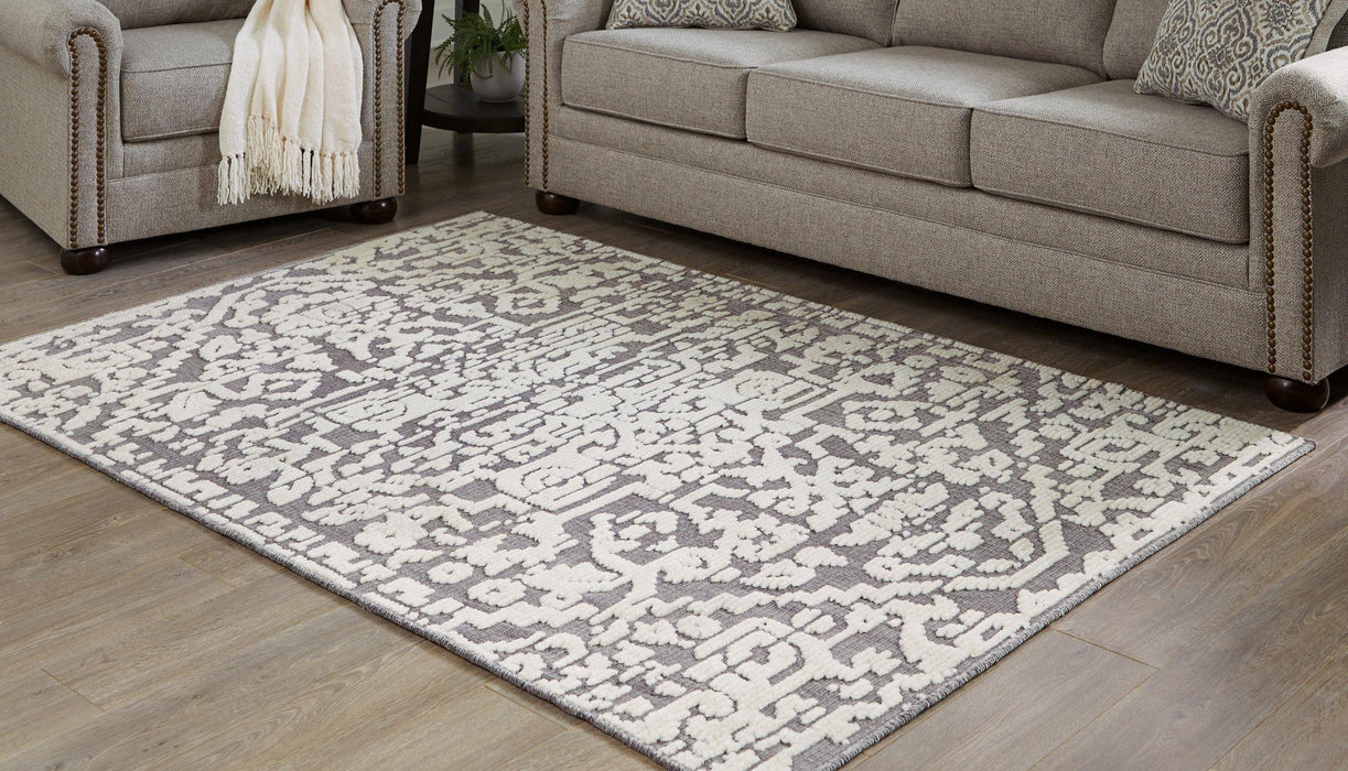 Oddetteley 4'11" x 7'2" Rug - Premium Rug from Ashley Furniture - Just $120.37! Shop now at Furniture Wholesale Plus  We are the best furniture store in Nashville, Hendersonville, Goodlettsville, Madison, Antioch, Mount Juliet, Lebanon, Gallatin, Springfield, Murfreesboro, Franklin, Brentwood