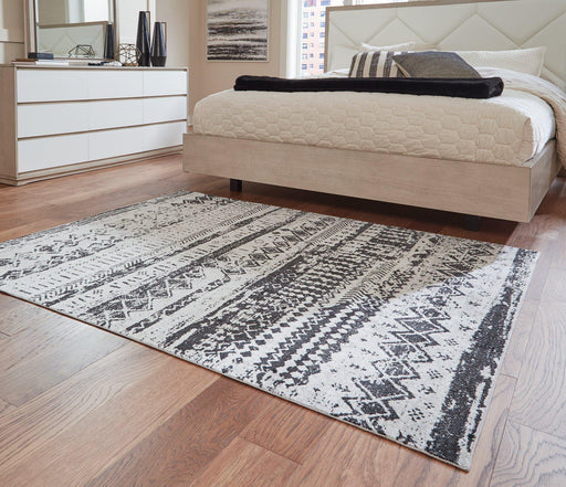 Devman 5'2" x 6'10" Rug - Premium Rug from Ashley Furniture - Just $92.13! Shop now at Furniture Wholesale Plus  We are the best furniture store in Nashville, Hendersonville, Goodlettsville, Madison, Antioch, Mount Juliet, Lebanon, Gallatin, Springfield, Murfreesboro, Franklin, Brentwood