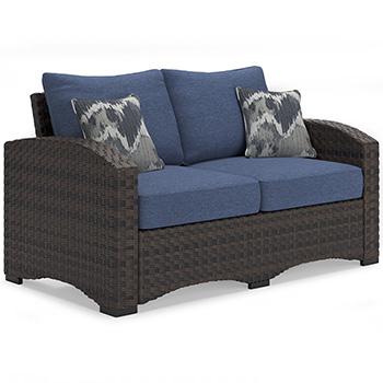 Windglow Outdoor Loveseat with Cushion - Premium Outdoor Seating from Ashley Furniture - Just $560.58! Shop now at Furniture Wholesale Plus  We are the best furniture store in Nashville, Hendersonville, Goodlettsville, Madison, Antioch, Mount Juliet, Lebanon, Gallatin, Springfield, Murfreesboro, Franklin, Brentwood