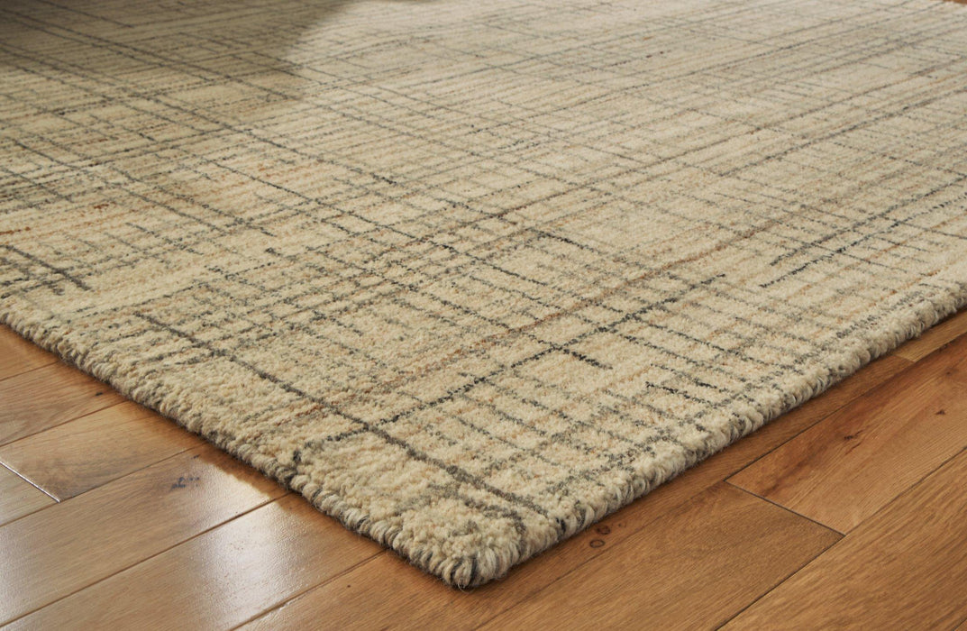 Janston Rug - Premium Rug Medium from Ashley Furniture - Just $175.10! Shop now at Furniture Wholesale Plus  We are the best furniture store in Nashville, Hendersonville, Goodlettsville, Madison, Antioch, Mount Juliet, Lebanon, Gallatin, Springfield, Murfreesboro, Franklin, Brentwood