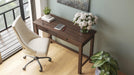 Camiburg 47" Home Office Desk - Premium Desk from Ashley Furniture - Just $223.68! Shop now at Furniture Wholesale Plus  We are the best furniture store in Nashville, Hendersonville, Goodlettsville, Madison, Antioch, Mount Juliet, Lebanon, Gallatin, Springfield, Murfreesboro, Franklin, Brentwood