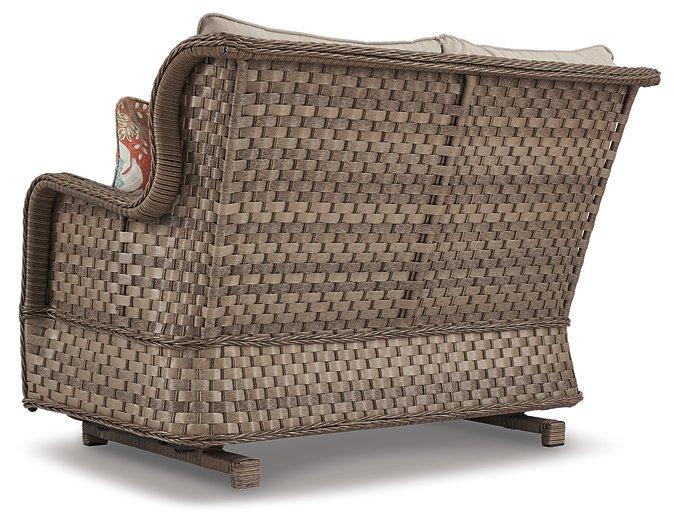 Clear Ridge Glider Loveseat with Cushion - Premium Outdoor Seating from Ashley Furniture - Just $652.38! Shop now at Furniture Wholesale Plus  We are the best furniture store in Nashville, Hendersonville, Goodlettsville, Madison, Antioch, Mount Juliet, Lebanon, Gallatin, Springfield, Murfreesboro, Franklin, Brentwood