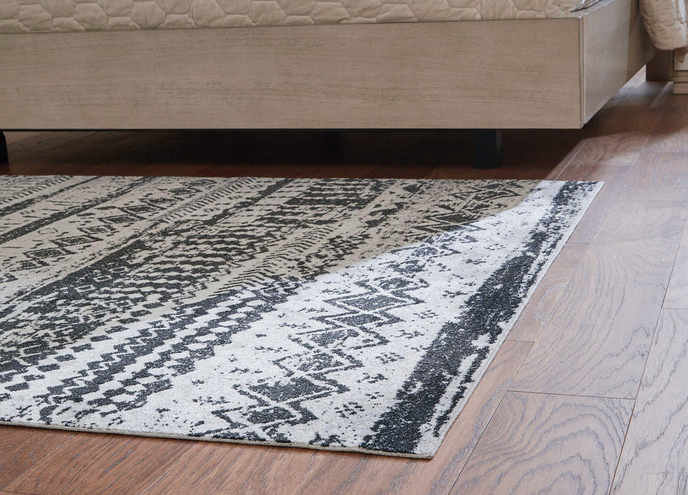 Devman 7'7" x 9'11" Rug - Premium Rug from Ashley Furniture - Just $177.38! Shop now at Furniture Wholesale Plus  We are the best furniture store in Nashville, Hendersonville, Goodlettsville, Madison, Antioch, Mount Juliet, Lebanon, Gallatin, Springfield, Murfreesboro, Franklin, Brentwood