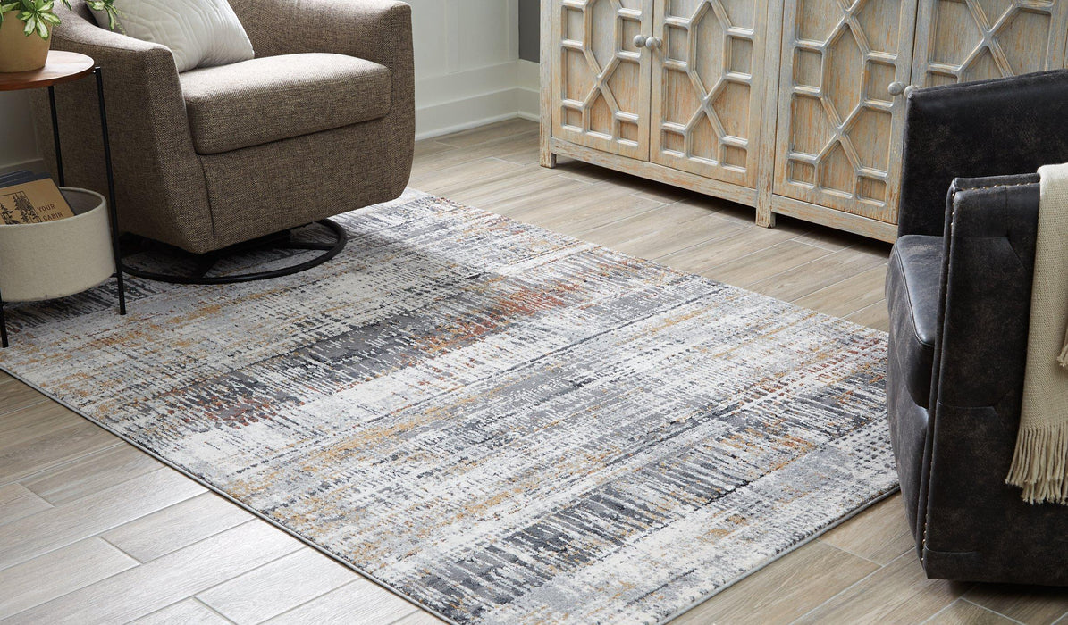 Rhettner 5'3" x 7'3" Rug - Premium Rug from Ashley Furniture - Just $187.46! Shop now at Furniture Wholesale Plus  We are the best furniture store in Nashville, Hendersonville, Goodlettsville, Madison, Antioch, Mount Juliet, Lebanon, Gallatin, Springfield, Murfreesboro, Franklin, Brentwood