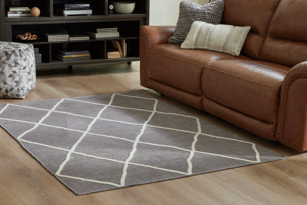 Stardo 4'11" x 7'2" Rug - Premium Rug from Ashley Furniture - Just $120.37! Shop now at Furniture Wholesale Plus  We are the best furniture store in Nashville, Hendersonville, Goodlettsville, Madison, Antioch, Mount Juliet, Lebanon, Gallatin, Springfield, Murfreesboro, Franklin, Brentwood