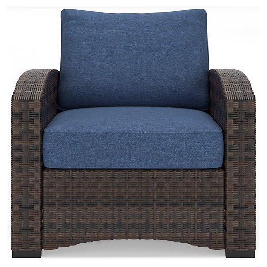 Windglow Outdoor Lounge Chair with Cushion - Premium Outdoor Seating from Ashley Furniture - Just $321.78! Shop now at Furniture Wholesale Plus  We are the best furniture store in Nashville, Hendersonville, Goodlettsville, Madison, Antioch, Mount Juliet, Lebanon, Gallatin, Springfield, Murfreesboro, Franklin, Brentwood