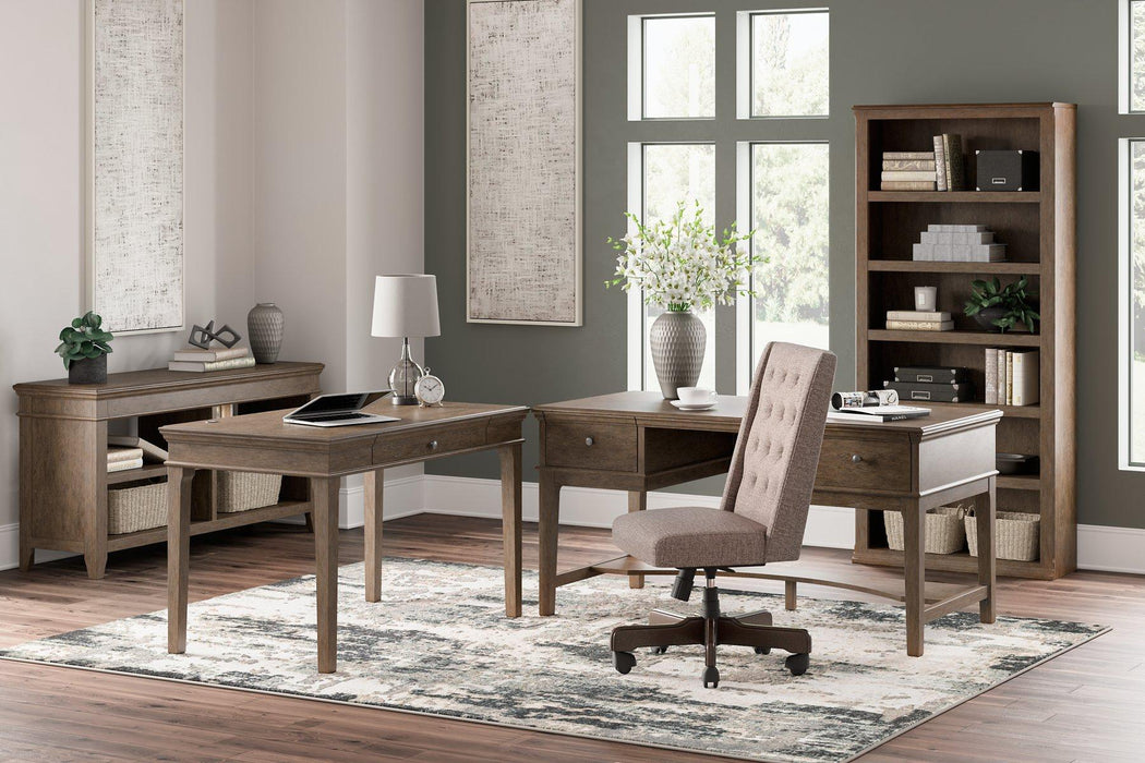 Janismore Home Office Storage Leg Desk - Premium Desk from Ashley Furniture - Just $579.20! Shop now at Furniture Wholesale Plus  We are the best furniture store in Nashville, Hendersonville, Goodlettsville, Madison, Antioch, Mount Juliet, Lebanon, Gallatin, Springfield, Murfreesboro, Franklin, Brentwood