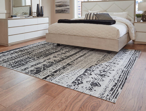 Devman 7'7" x 9'11" Rug - Premium Rug from Ashley Furniture - Just $177.38! Shop now at Furniture Wholesale Plus  We are the best furniture store in Nashville, Hendersonville, Goodlettsville, Madison, Antioch, Mount Juliet, Lebanon, Gallatin, Springfield, Murfreesboro, Franklin, Brentwood