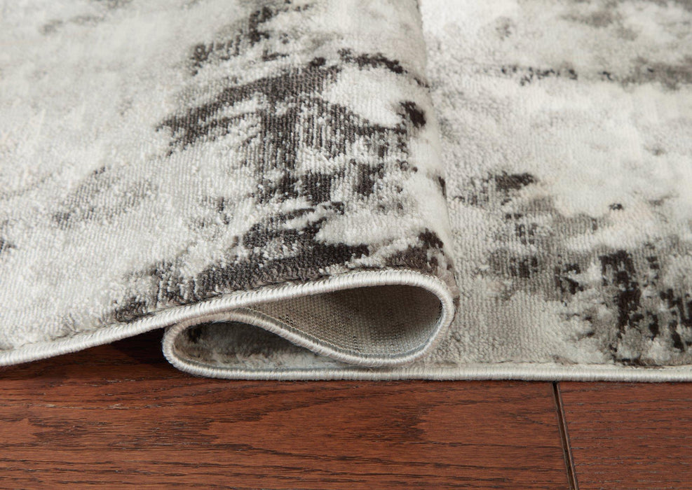 Greyland 5' x 7' Rug - Premium Rug from Ashley Furniture - Just $81.54! Shop now at Furniture Wholesale Plus  We are the best furniture store in Nashville, Hendersonville, Goodlettsville, Madison, Antioch, Mount Juliet, Lebanon, Gallatin, Springfield, Murfreesboro, Franklin, Brentwood