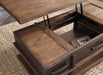 Stanah Coffee Table with Lift Top - Premium Cocktail Table Lift from Ashley Furniture - Just $408.03! Shop now at Furniture Wholesale Plus  We are the best furniture store in Nashville, Hendersonville, Goodlettsville, Madison, Antioch, Mount Juliet, Lebanon, Gallatin, Springfield, Murfreesboro, Franklin, Brentwood