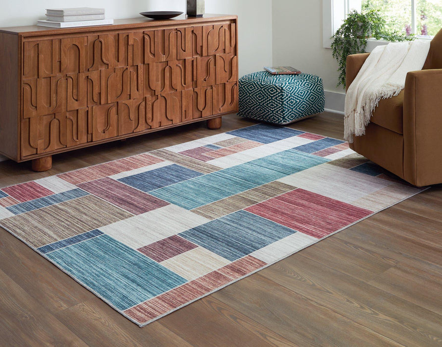 Numore Rug - Premium Rug Large from Ashley Furniture - Just $90.36! Shop now at Furniture Wholesale Plus  We are the best furniture store in Nashville, Hendersonville, Goodlettsville, Madison, Antioch, Mount Juliet, Lebanon, Gallatin, Springfield, Murfreesboro, Franklin, Brentwood