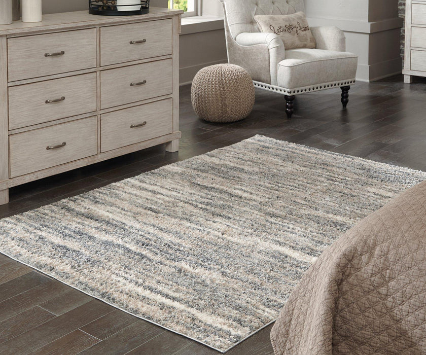 Gizela 5'3" x 7'3" Rug - Premium Rug from Ashley Furniture - Just $102.72! Shop now at Furniture Wholesale Plus  We are the best furniture store in Nashville, Hendersonville, Goodlettsville, Madison, Antioch, Mount Juliet, Lebanon, Gallatin, Springfield, Murfreesboro, Franklin, Brentwood