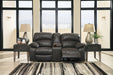 Dunwell Power Reclining Loveseat with Console - Premium Loveseat from Ashley Furniture - Just $1261.44! Shop now at Furniture Wholesale Plus  We are the best furniture store in Nashville, Hendersonville, Goodlettsville, Madison, Antioch, Mount Juliet, Lebanon, Gallatin, Springfield, Murfreesboro, Franklin, Brentwood