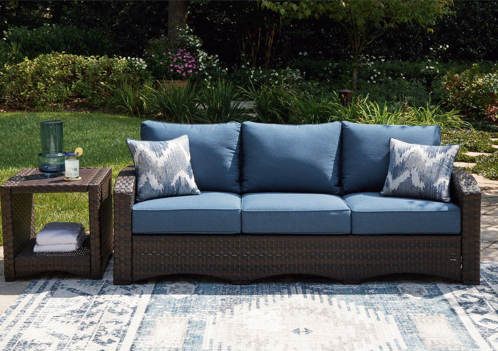 Windglow Outdoor Sofa with Cushion - Premium Outdoor Seating from Ashley Furniture - Just $801.15! Shop now at Furniture Wholesale Plus  We are the best furniture store in Nashville, Hendersonville, Goodlettsville, Madison, Antioch, Mount Juliet, Lebanon, Gallatin, Springfield, Murfreesboro, Franklin, Brentwood