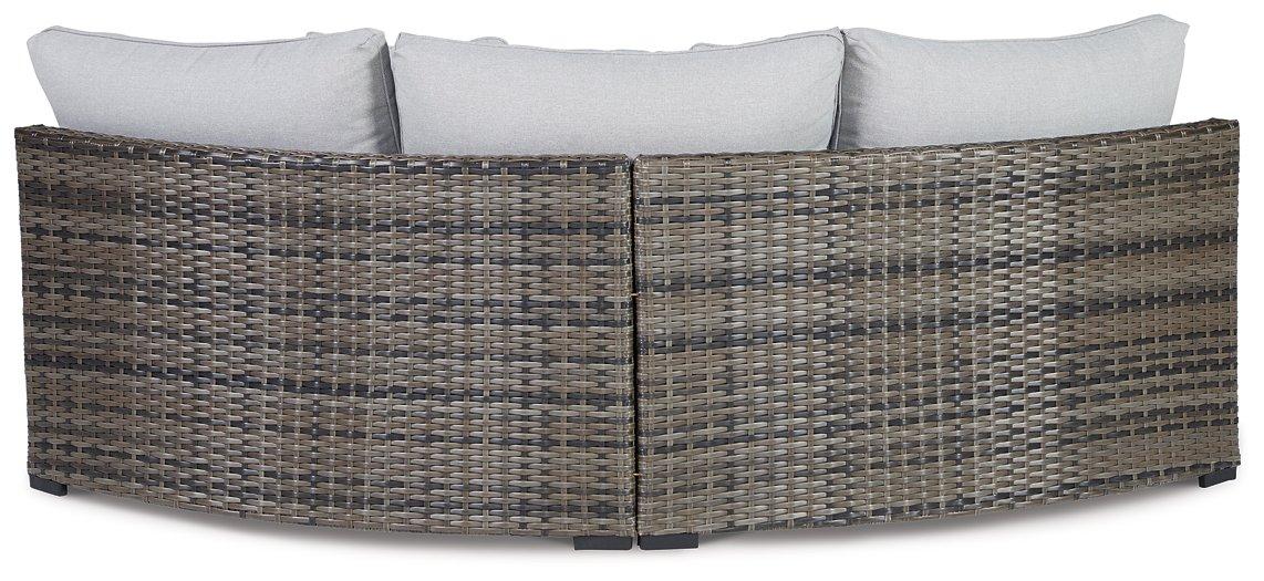 Harbor Court Curved Loveseat with Cushion - Premium Outdoor Seating from Ashley Furniture - Just $733.59! Shop now at Furniture Wholesale Plus  We are the best furniture store in Nashville, Hendersonville, Goodlettsville, Madison, Antioch, Mount Juliet, Lebanon, Gallatin, Springfield, Murfreesboro, Franklin, Brentwood