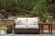 Paradise Trail Loveseat with Cushion - Premium Outdoor Seating from Ashley Furniture - Just $1007.22! Shop now at Furniture Wholesale Plus  We are the best furniture store in Nashville, Hendersonville, Goodlettsville, Madison, Antioch, Mount Juliet, Lebanon, Gallatin, Springfield, Murfreesboro, Franklin, Brentwood