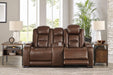 The Man-Den Power Reclining Loveseat with Console - Premium Loveseat from Ashley Furniture - Just $2152.97! Shop now at Furniture Wholesale Plus  We are the best furniture store in Nashville, Hendersonville, Goodlettsville, Madison, Antioch, Mount Juliet, Lebanon, Gallatin, Springfield, Murfreesboro, Franklin, Brentwood