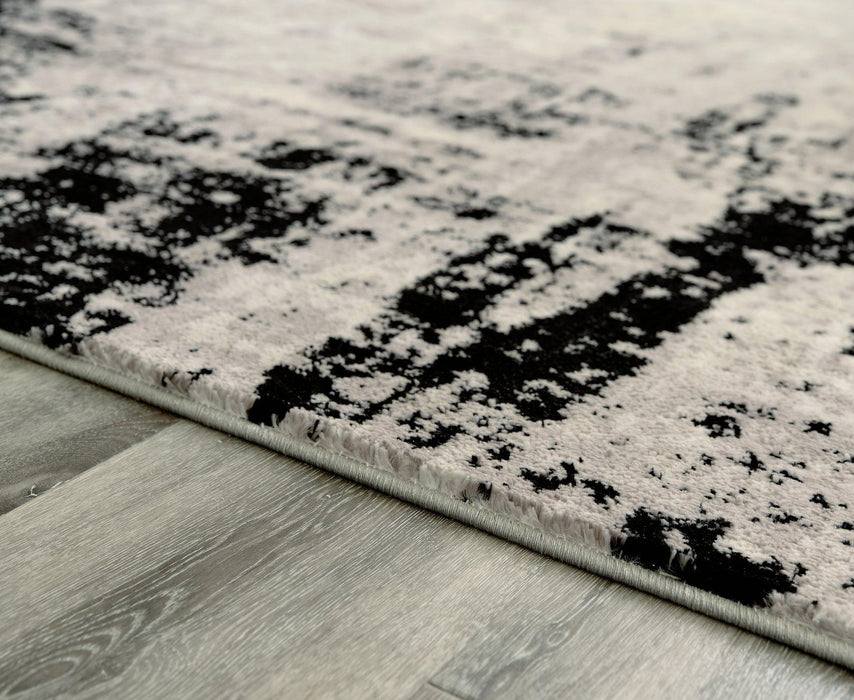 Zekeman 7'10" x 10' Rug - Premium Rug from Ashley Furniture - Just $249.76! Shop now at Furniture Wholesale Plus  We are the best furniture store in Nashville, Hendersonville, Goodlettsville, Madison, Antioch, Mount Juliet, Lebanon, Gallatin, Springfield, Murfreesboro, Franklin, Brentwood