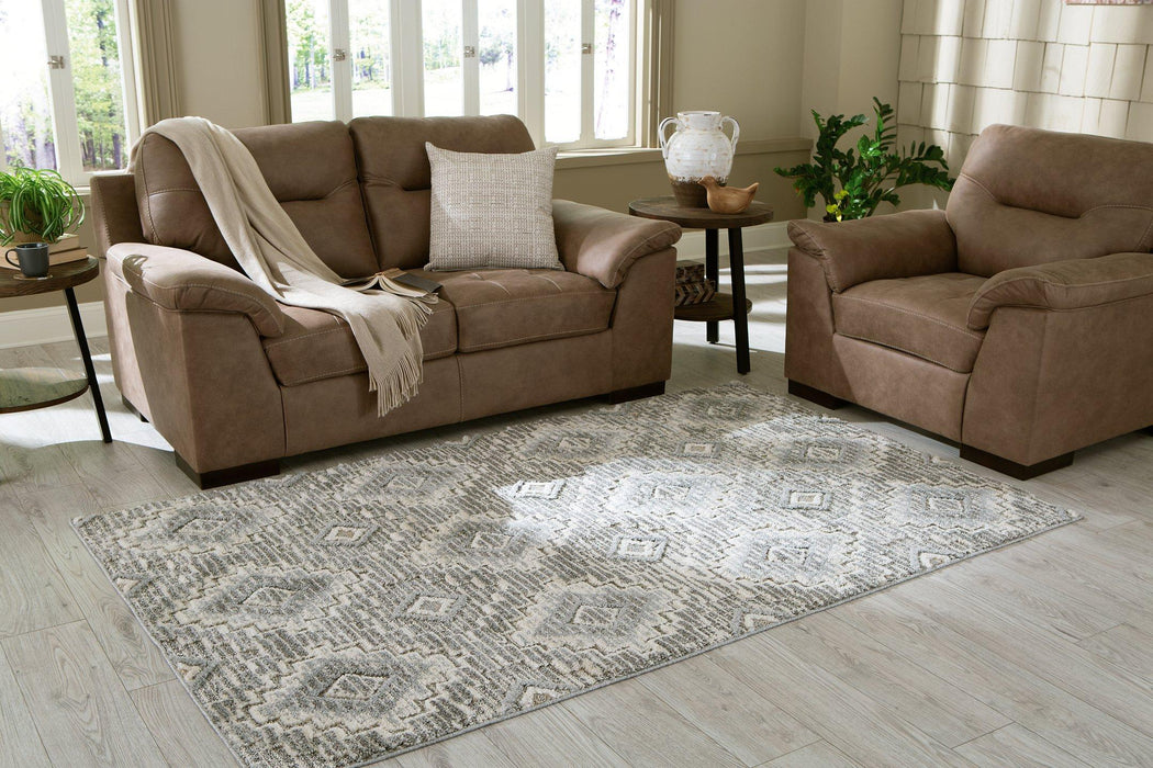 Monwick 7'10" x 10'3" Rug - Premium Rug from Ashley Furniture - Just $240.93! Shop now at Furniture Wholesale Plus  We are the best furniture store in Nashville, Hendersonville, Goodlettsville, Madison, Antioch, Mount Juliet, Lebanon, Gallatin, Springfield, Murfreesboro, Franklin, Brentwood