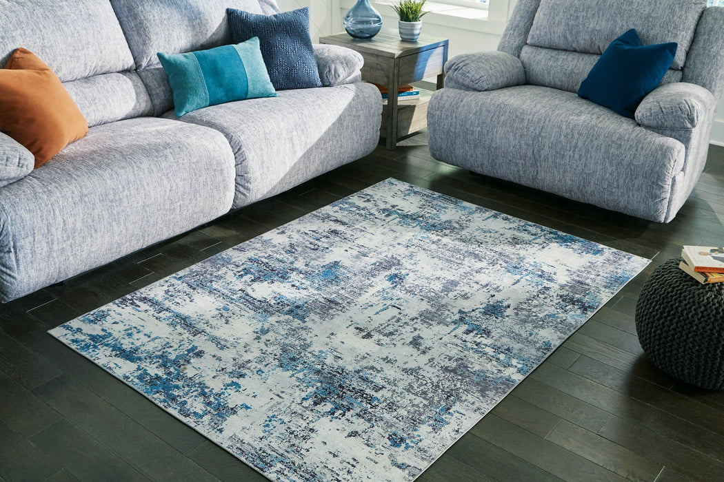 Putmins 5' x 7' Rug - Premium Rug from Ashley Furniture - Just $74.47! Shop now at Furniture Wholesale Plus  We are the best furniture store in Nashville, Hendersonville, Goodlettsville, Madison, Antioch, Mount Juliet, Lebanon, Gallatin, Springfield, Murfreesboro, Franklin, Brentwood