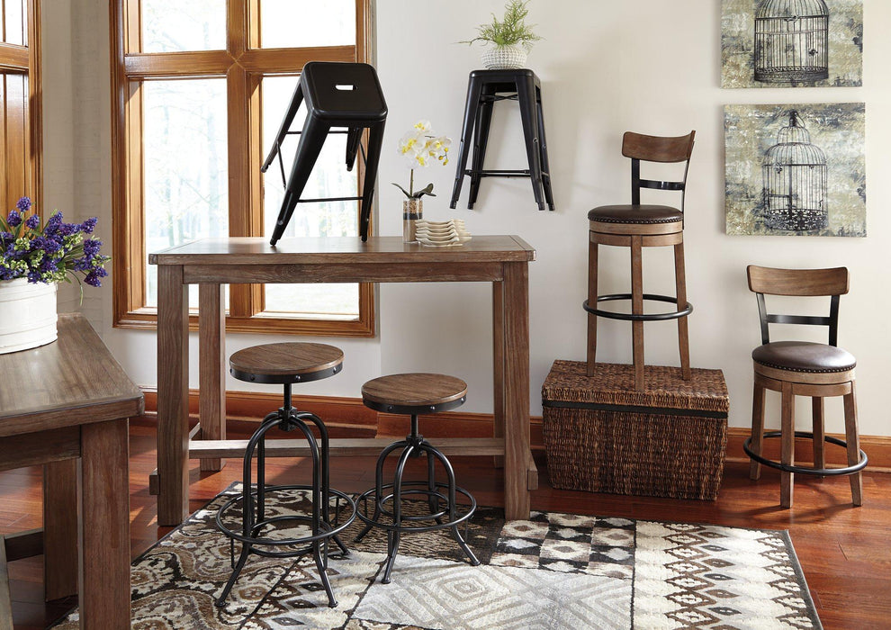 Pinnadel Bar Height Bar Stool - Premium Barstool from Ashley Furniture - Just $176.98! Shop now at Furniture Wholesale Plus  We are the best furniture store in Nashville, Hendersonville, Goodlettsville, Madison, Antioch, Mount Juliet, Lebanon, Gallatin, Springfield, Murfreesboro, Franklin, Brentwood